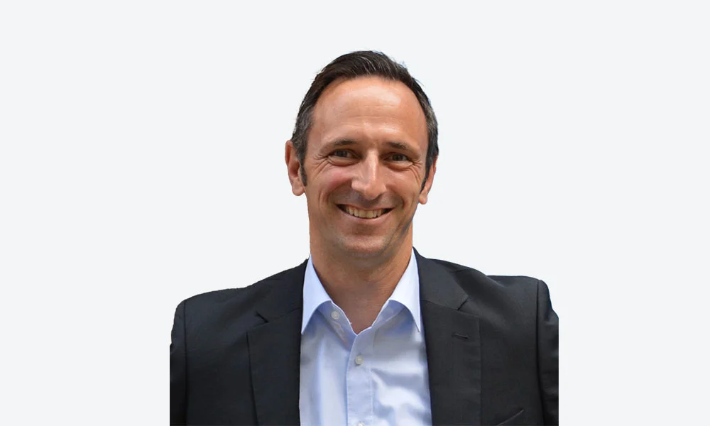 Smiling business professional in formal attire Axel Doll